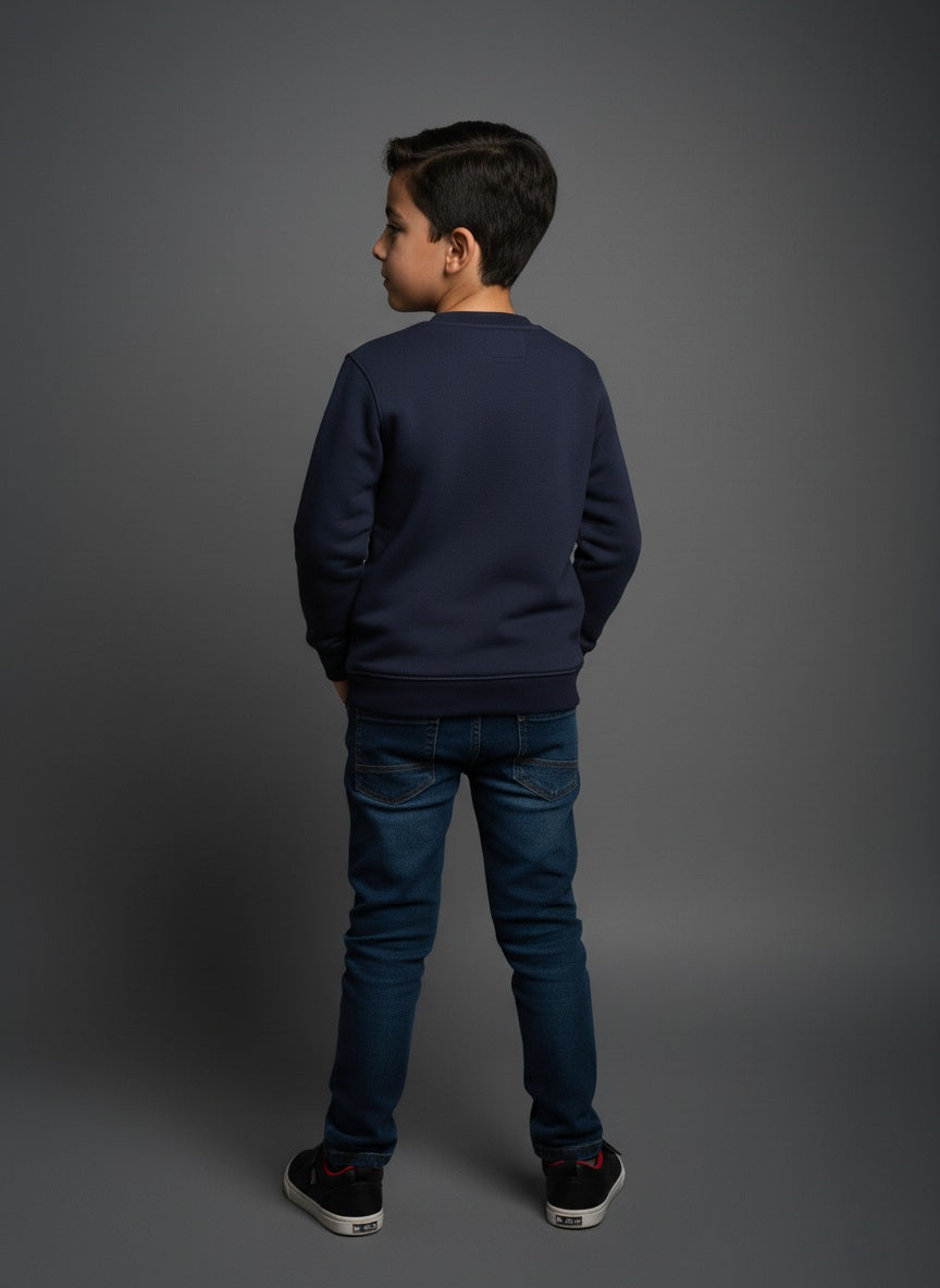 Child wearing a navy blue cotton sweatshirt and jeans on a gray background- zoonikid