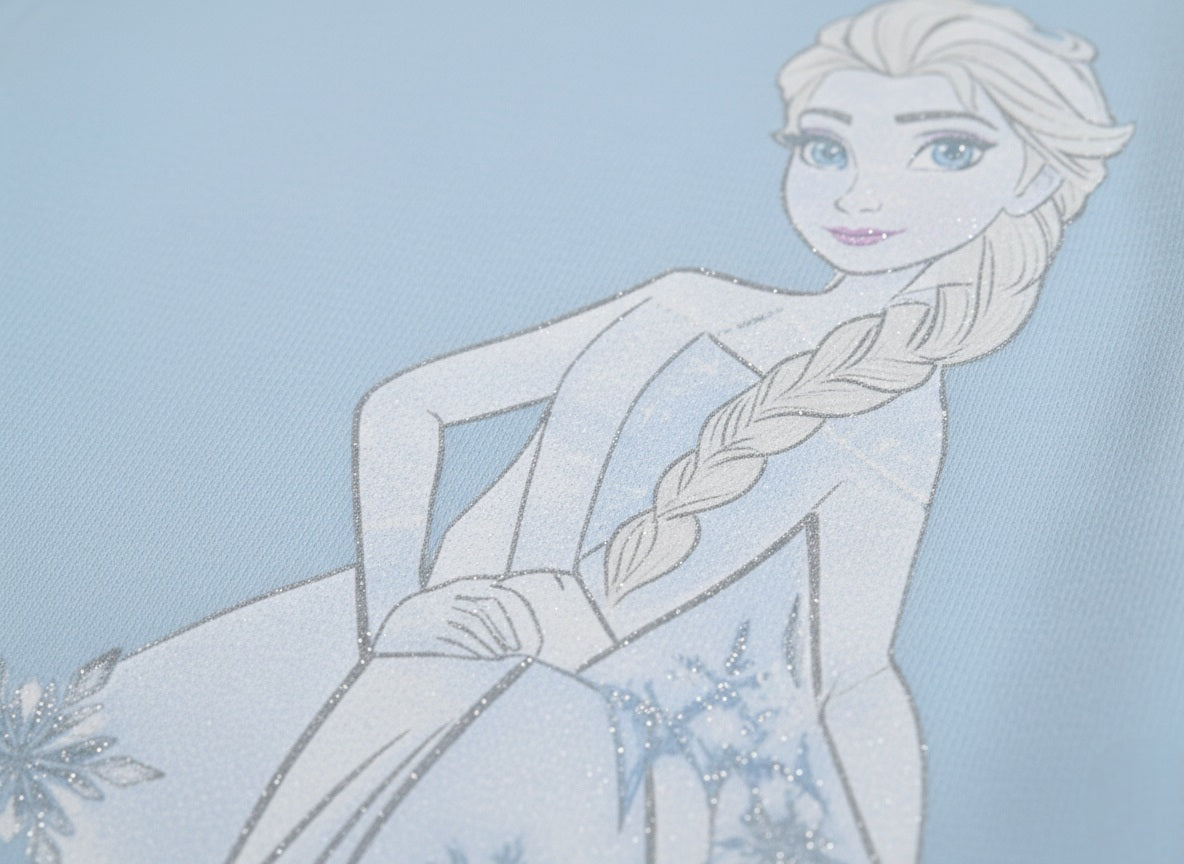 Frozen in a white dress with braided hair against a light blue background
