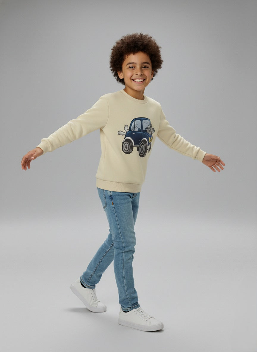Child wearing a beige cotton sweatshirt with a car design on a gray background
