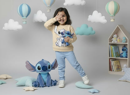 Child in a room with 'Lilo & Stitch' theme, holding a plush toy, surrounded by cloud decorations and books.