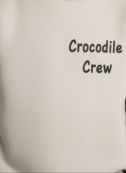 Gray hoodie with 'Crocodile Crew' text on a plain background