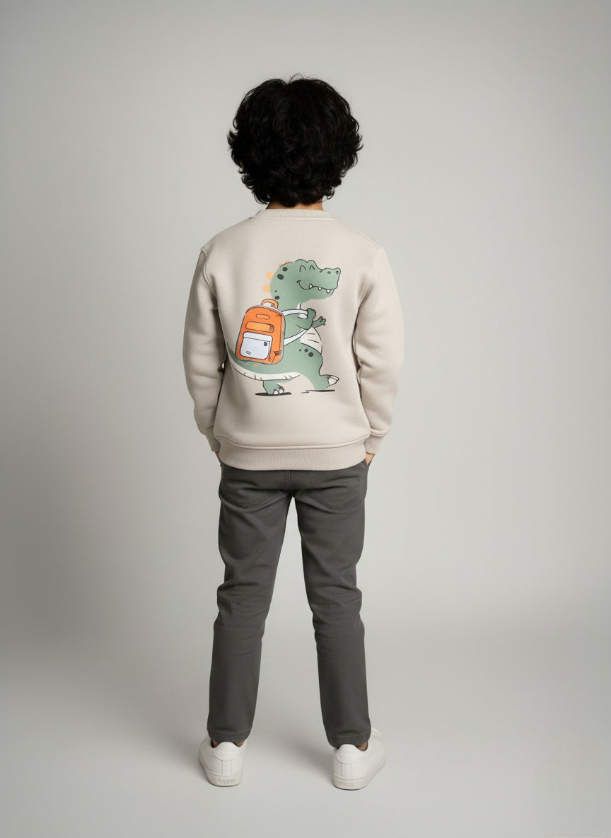 Person wearing a gray sweatshirt with a dinosaur graphic on the back against a plain background