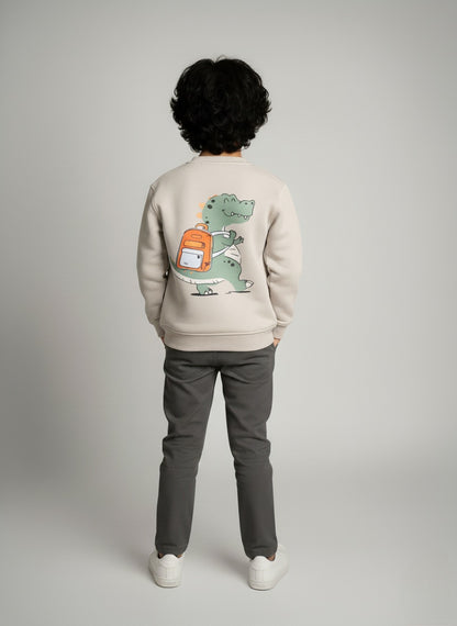 Person wearing a gray sweatshirt with a dinosaur graphic on the back against a plain background