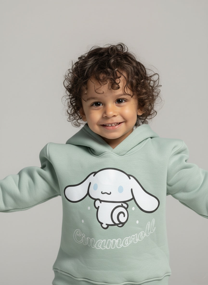 Child wearing a mint green hoodie with a Cinnamoroll character and text on a gray background