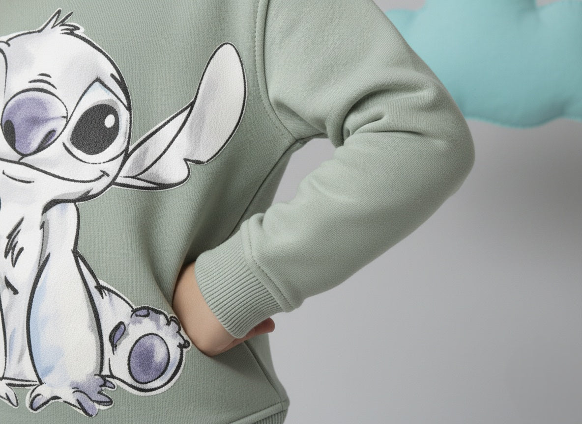 Mint green sweatshirt with a cute stitch design on a plain background