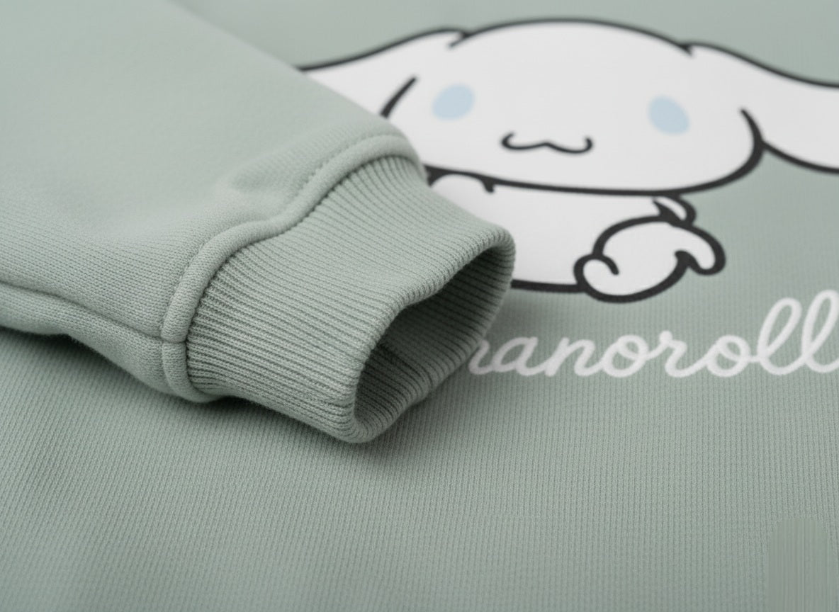 Folded mint green fabric with a cinnamoroll character and text on a matching background