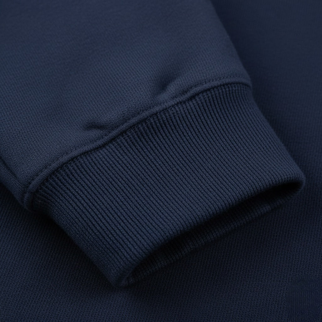 Close-up of a navy blue fabric with a visible seam